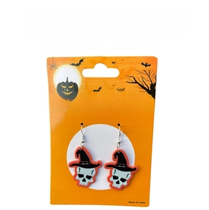 Detail shot of skeleton earrings with black wizard hat and orange details on card