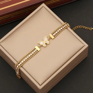 Chic triple-layer gold butterfly bracelet with white shell inlay and sparkling crystals