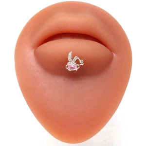 Silver rabbit labret stud with pink heart gemstone shown on professional lip model