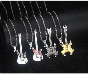 Detail view of colorful guitar necklaces in white, red, black and gold steel finishes