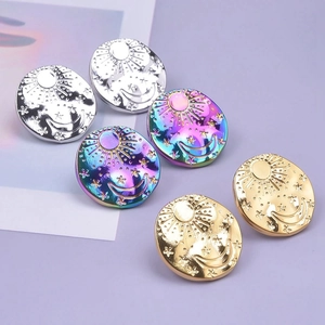 Polished stainless steel stud earrings with sun, moon, and star celestial relief designs
