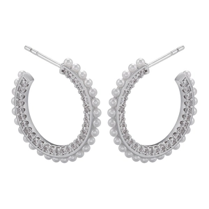 Silver C-shaped hoop earrings with micro-paved cubic zirconia and pearls on white background