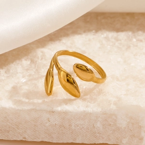 18K gold plated stainless steel open leaf ring on a natural white stone base
