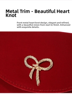 Close-up of red velvet handbag featuring an intricate golden metal knot detail