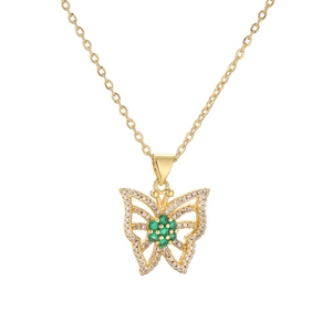Elegant gold butterfly necklace with green gemstone flower and sparkling crystals