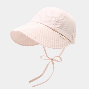 Detail of pink striped baby sun hat featuring wide brim and adjustable chin strap bow