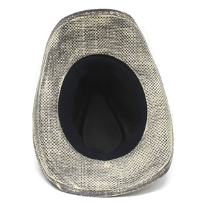 Detail of grey straw sun hat interior with black sweatband and fine woven texture