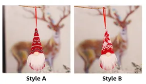 Close-up of knit Christmas gnomes with snowflake patterns and red hanging ropes