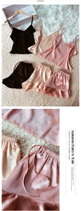 Detail of satin pajama sets with ruffled shorts in black, gold, and pink colors