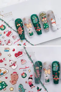 Detailed 3D embossed Christmas nail stickers featuring gingerbread men and trees