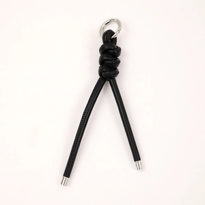 Handcrafted black PU braided leather keychain with a silver metal ring for bags and keys