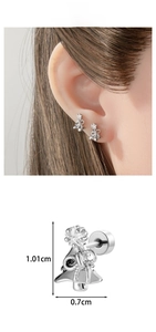 Detail view of a silver Christmas tree earring with dimensions 1.01cm by 0.7cm