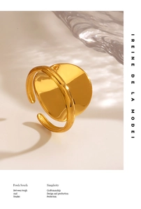 Macro detail of 18K gold plated geometric ring with mirror finish and adjustable open band