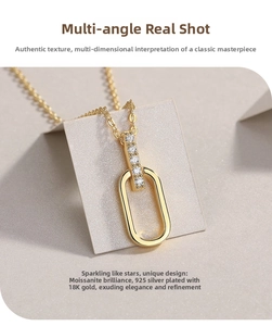 Detail of 925 silver 18K gold plated U-shape pendant set with sparkling moissanite gems