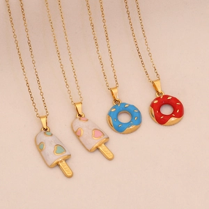 Gold stainless steel necklaces with donut and ice cream enamel pendants set on beige background