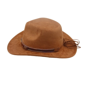 Side detail of a brown faux suede cowboy hat featuring an ethnic woven tassel band