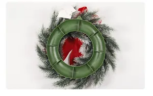 Back view of Christmas wreath featuring green plastic support ring and white frosted pine needles