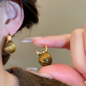 Elegant tiger eye stone bead hoop earrings with golden metal rings for a vintage look