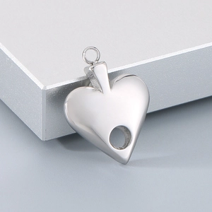 Detailed view of silver hollow heart pendant accessory for DIY jewelry necklaces