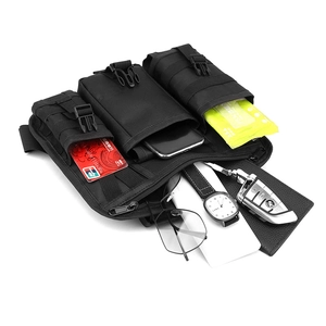 Detail view of tactical chest bag with three compartments holding essential daily items