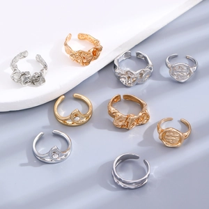 Detailed arrangement of diverse gold and silver adjustable rings with minimalist designs