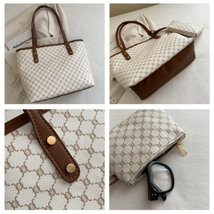 Detail view of large tote and inner pouch set with vintage pattern and leather trim