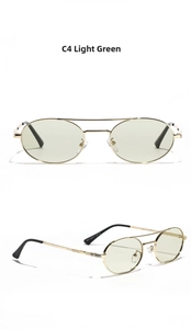 Detailed macro view of retro gold metal double bridge sunglasses with green resin lenses