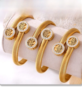 Macro detail of Tree of Life gold bangle with PVD plating and sparkling cubic zirconia