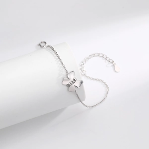 Detailed view of silver butterfly pendant bracelet with adjustable lobster clasp