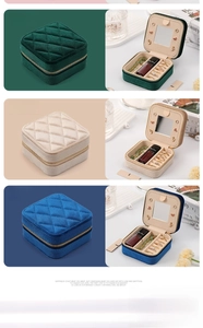 Vertical view of velvet jewelry boxes in green, khaki, and blue with zipper closure
