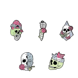 Detail view of five enamel pins featuring skull, mushroom, and rose with size specs