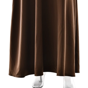 Detailed view of the flowing brown satin hem of an elegant backless evening maxi dress