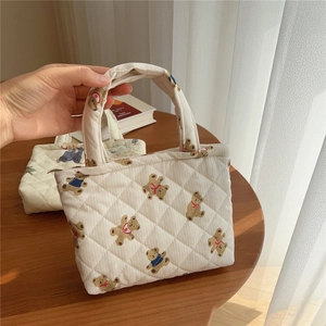 Detailed view of quilted cotton mini tote bag with cute brown teddy bear prints