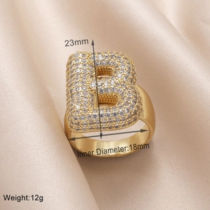 Detail view of gold letter B ring with size 23mm, diameter 18mm, and weight 12g