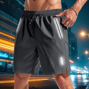Detail of reflective strips and drawstring on men's quick-dry night running shorts