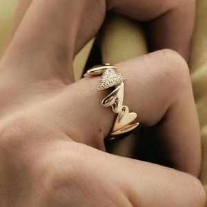 Elegant 18k gold heart-shaped ring with zircon stones worn on hand for women