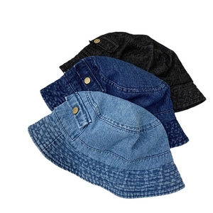 Denim bucket hats in light blue, dark blue and black with side pocket and metal button