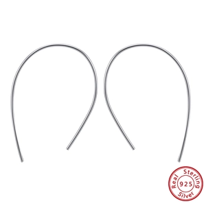 Detailed view of irregular geometric S925 sterling silver hoop earrings on white background