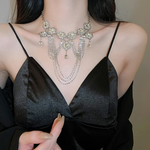 Detailed view of luxury multi-layer fringe necklace with crystal geometric pendants