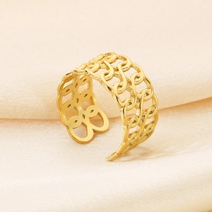 Macro detail of gold-plated open ring featuring a hollow interlocking chain texture design