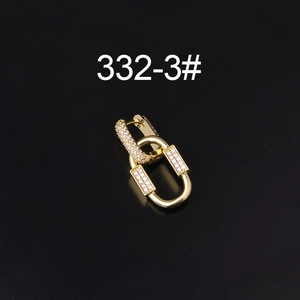 Macro detail of gold-plated interlocking earrings with sparkling cubic zirconia inlay