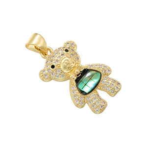 Detail of gold bear pendant with clear crystals and blue-green shell inlay belly