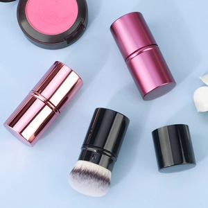 Detail showing the portable retractable makeup brush set with dual-tone bristles