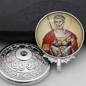 Macro detail of religious icon metal ornament with portrait and screw base