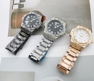 Close-up of three men's quartz watches with octagonal steel bezels and metal straps