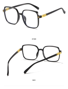 Detail view showing 45-degree and back angles of square black frames with gold accents