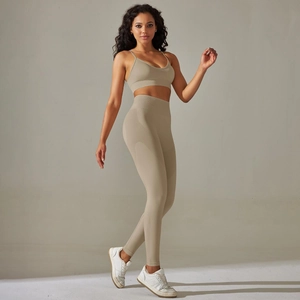 Detail of breathable knitted yoga set with high waist leggings and seamless sports bra