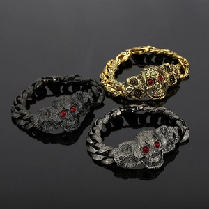 Bracelets tête de mort punk avec yeux rouges en finitions or, noir et argent pour homme