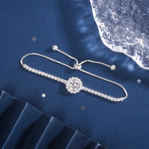 Detail of flower-shaped silver bracelet with zircon crystal pavé and adjustable sliding clasp