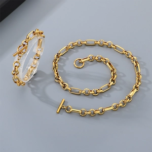 Detailed macro view of 18K gold-plated titanium chain with textured rings and toggle clasp